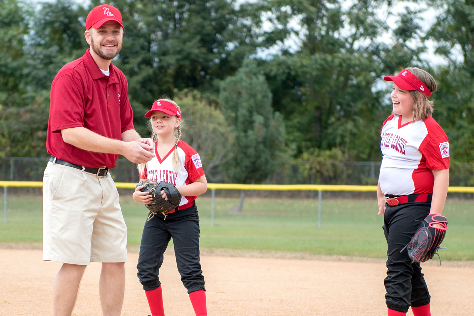 sb-coach-players-smiling-field