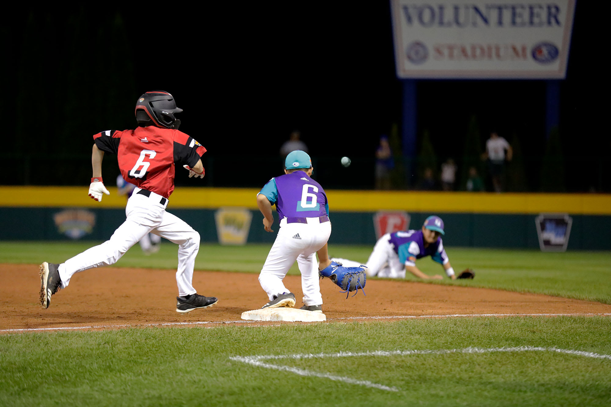 Canada player running towards base