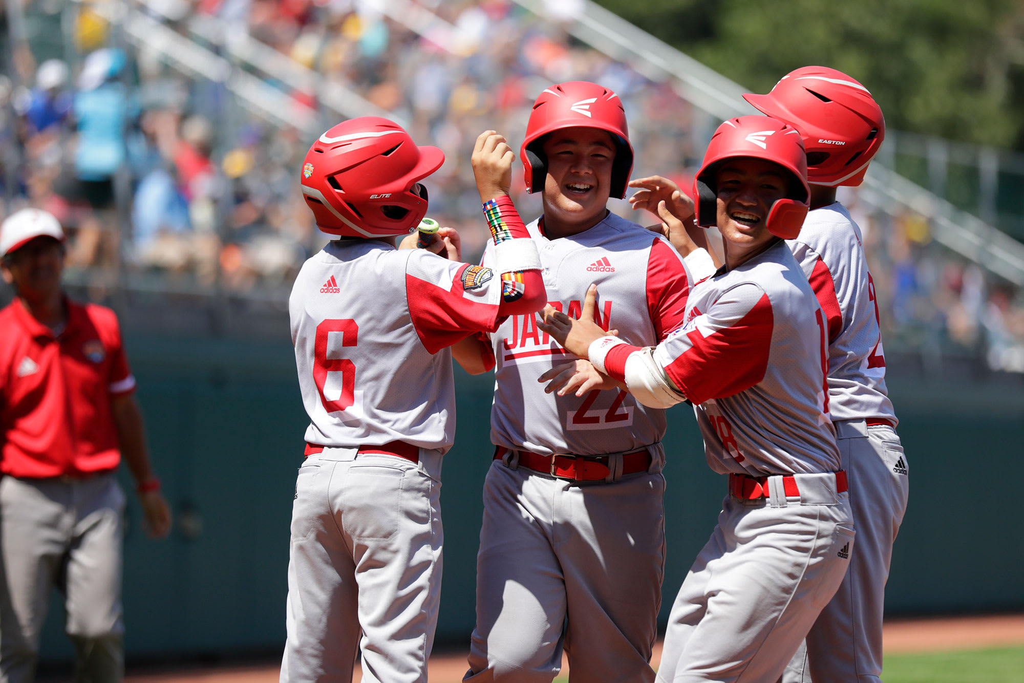 japan team celebrating at home plate