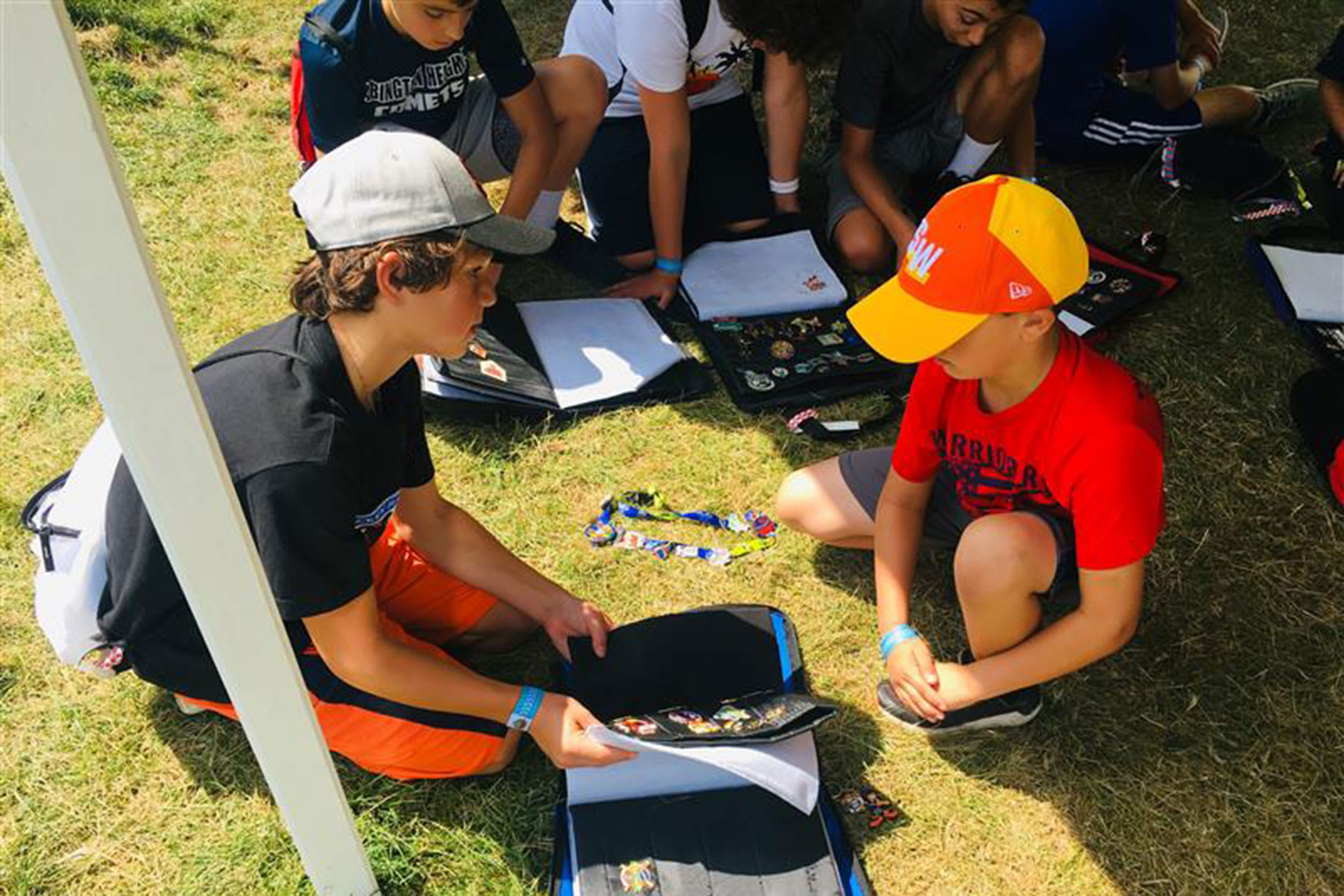 young boys trading pins