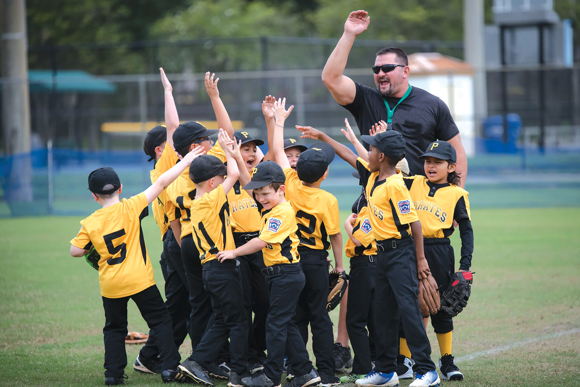 coach and players high fiving