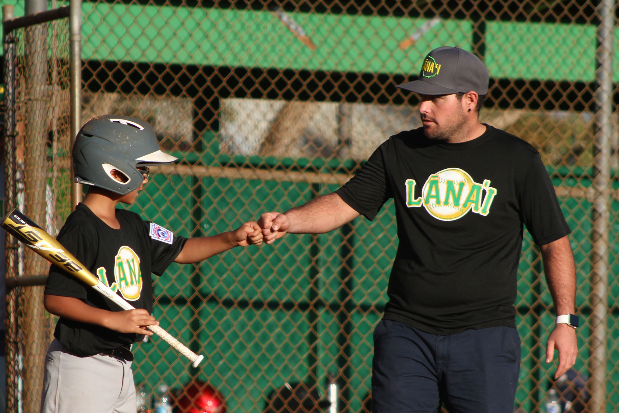 coach-player-fist-bumping