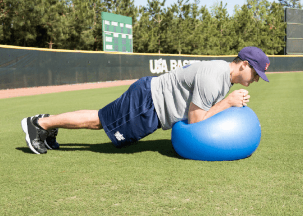 person doing exercises on ball