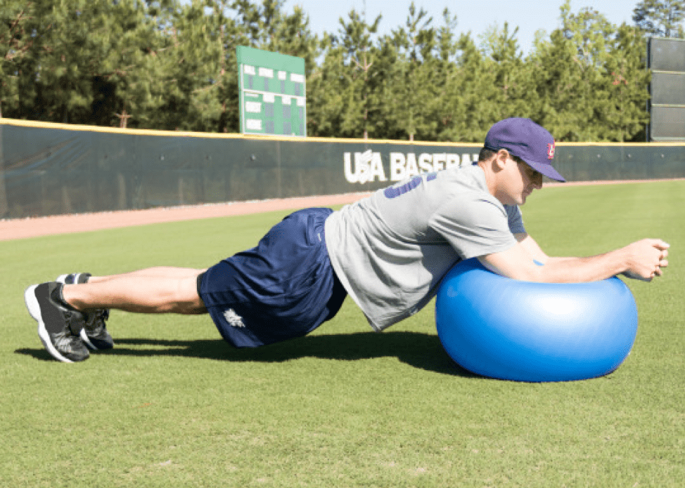 person doing exercises on ball