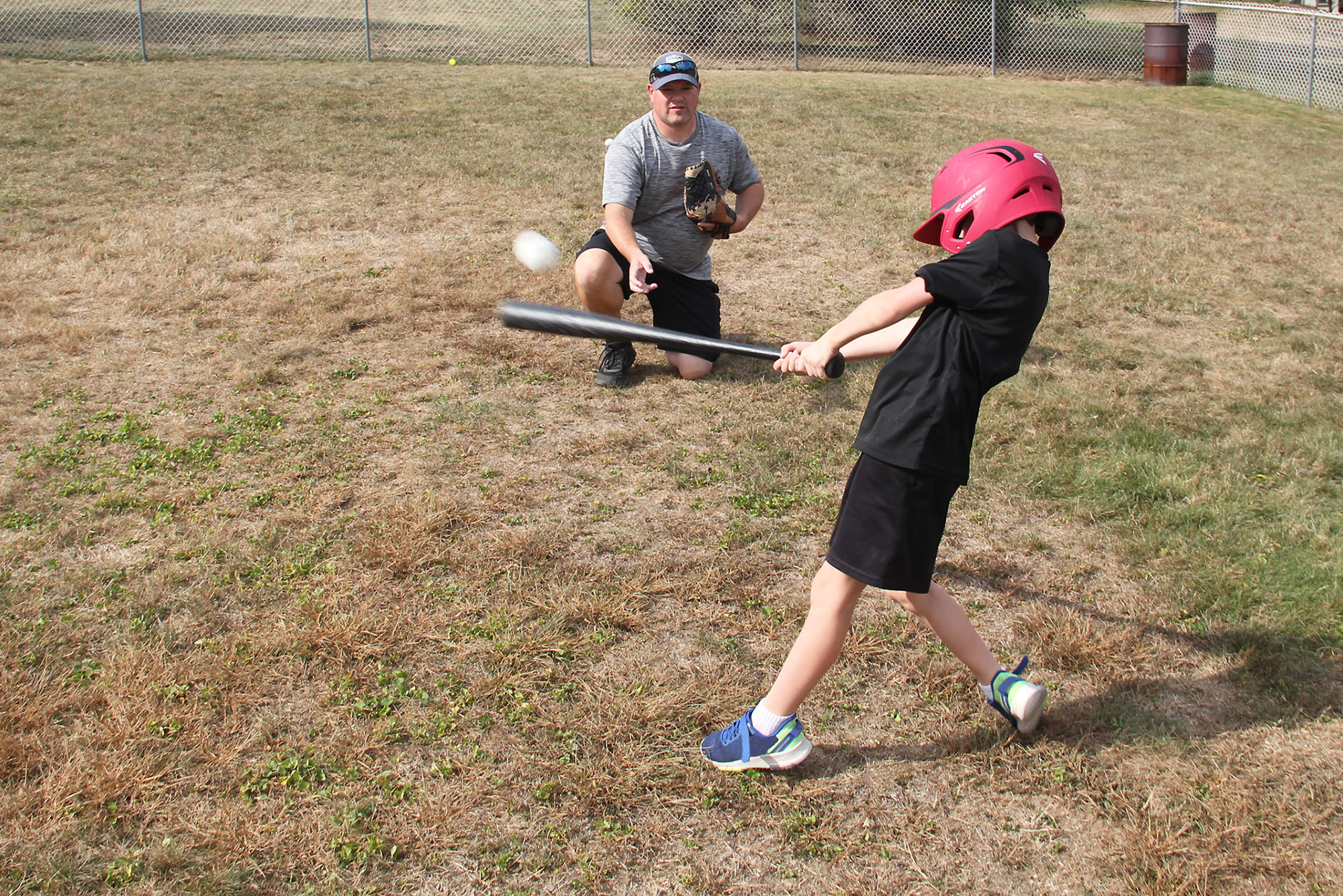 player hitting tossed ball