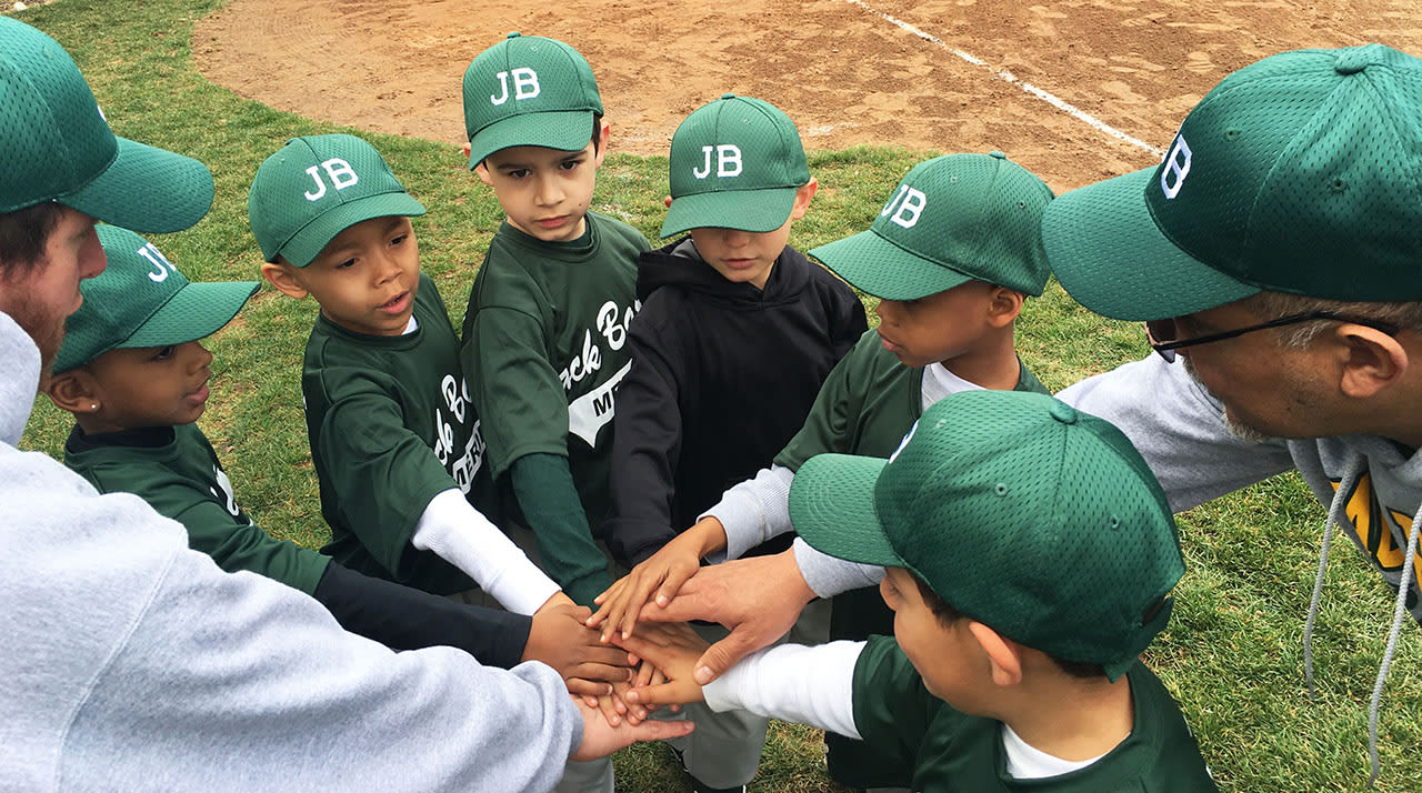 Team putting hands in