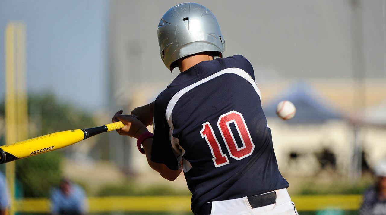 baseball player swinging bat