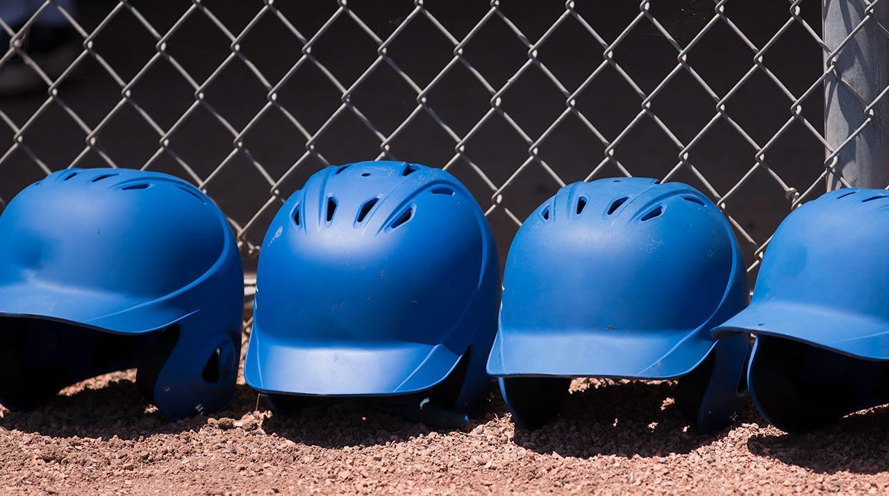 helmets along fence