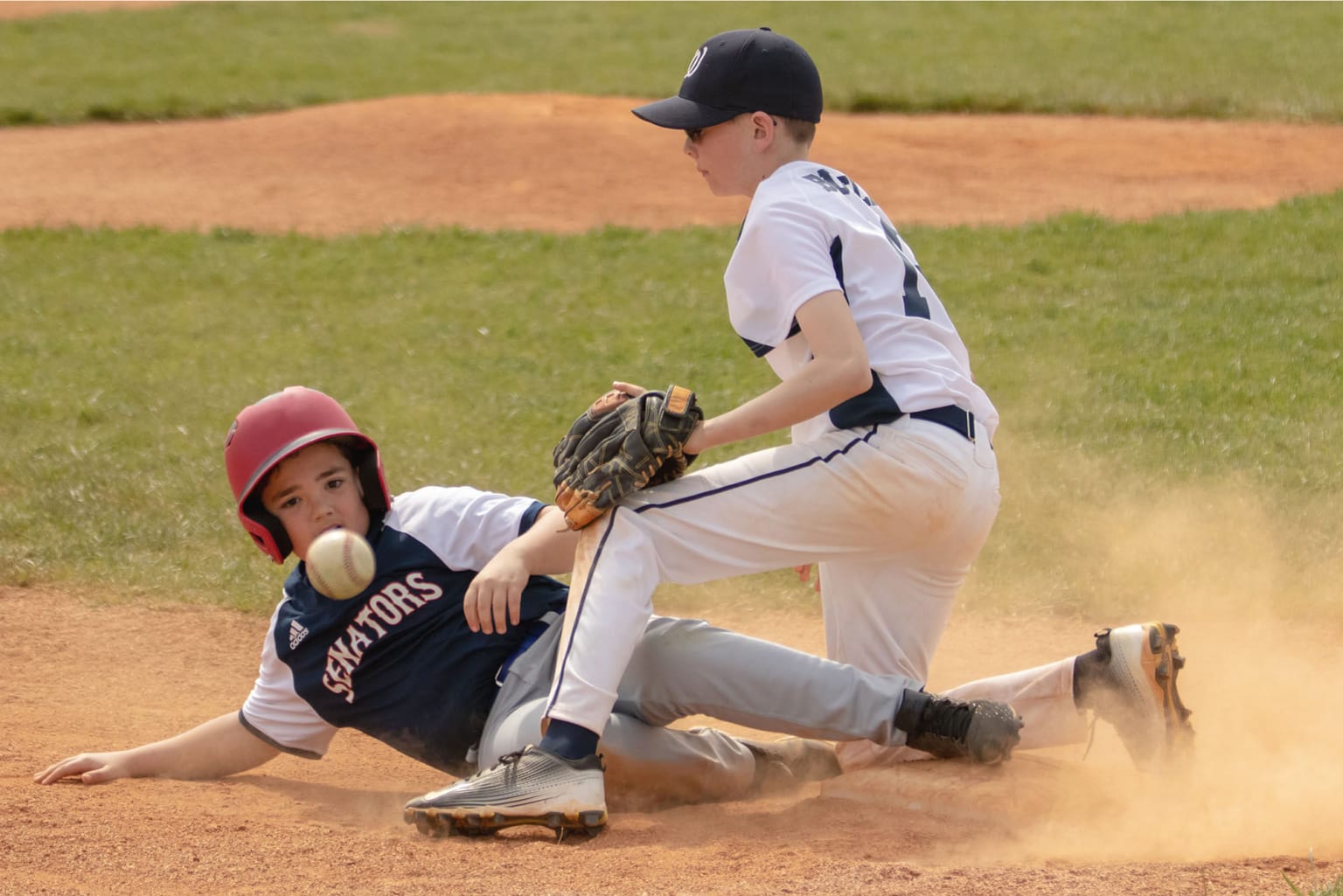 bb player sliding as other is catching ball