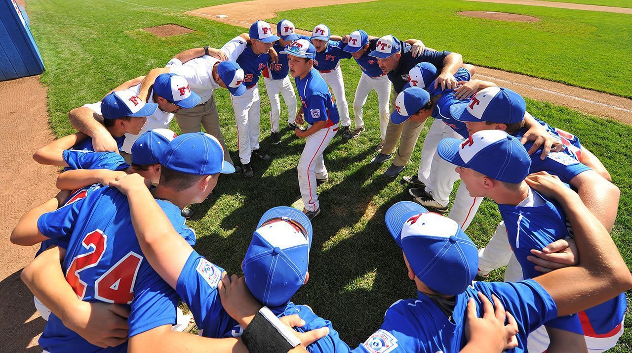 players and coach in circle