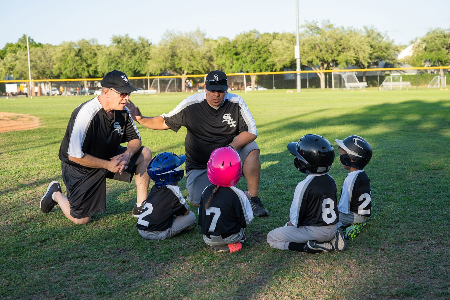 coaches talking to player