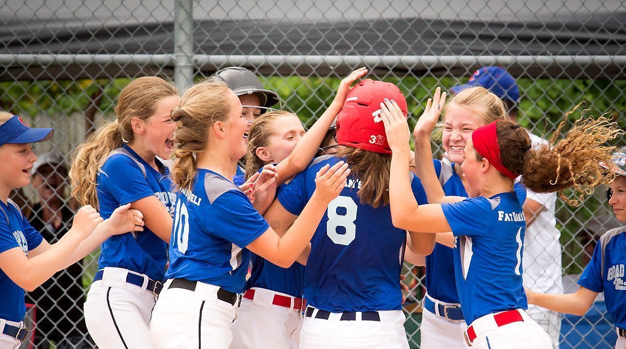 combined-teams-softball-team-congratulating-player