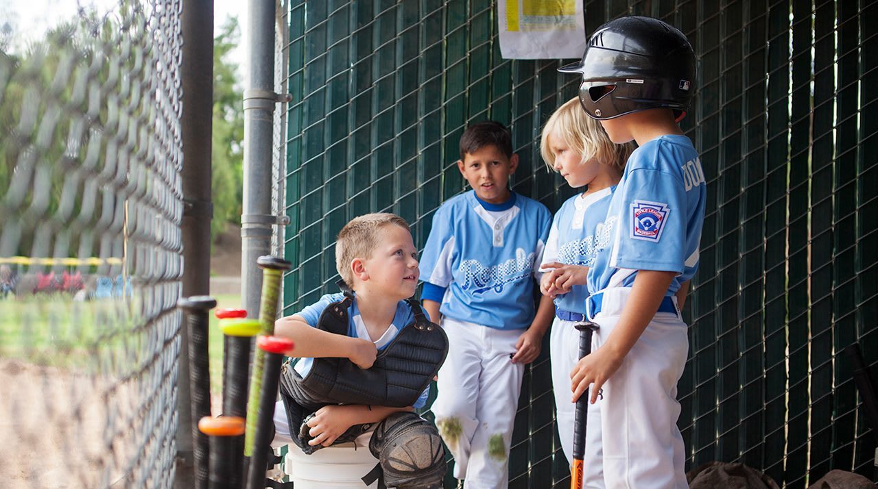 players talking in dugout
