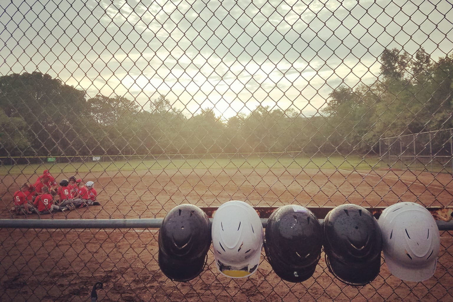 helmets-fence-team-on-field