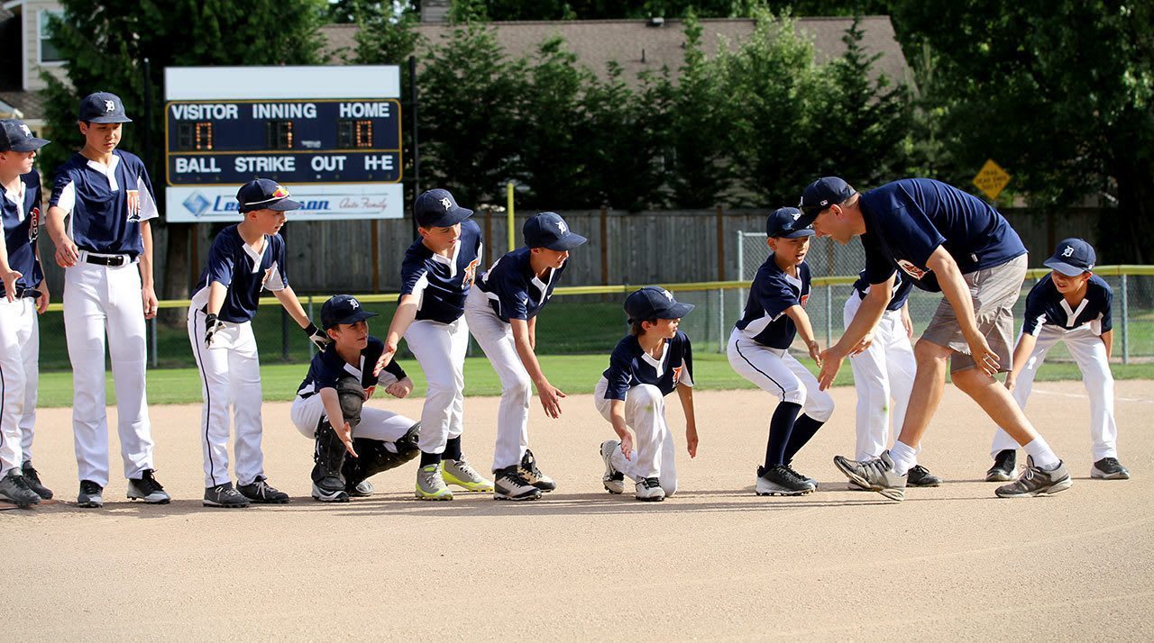 team and coach high-fiving