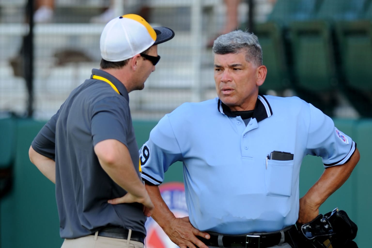 umpire and manager talking