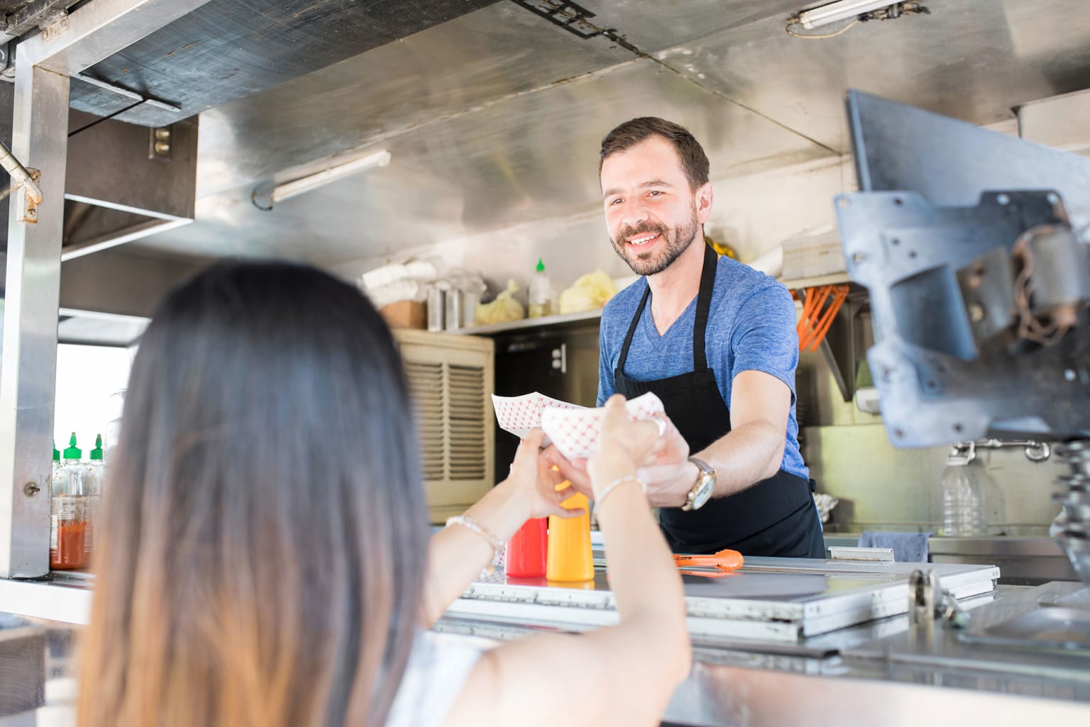 concession stand worker handing food