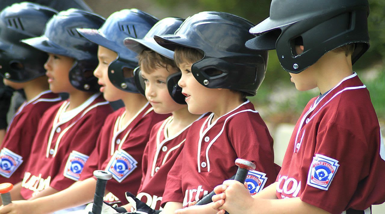 baseball players sitting on bench