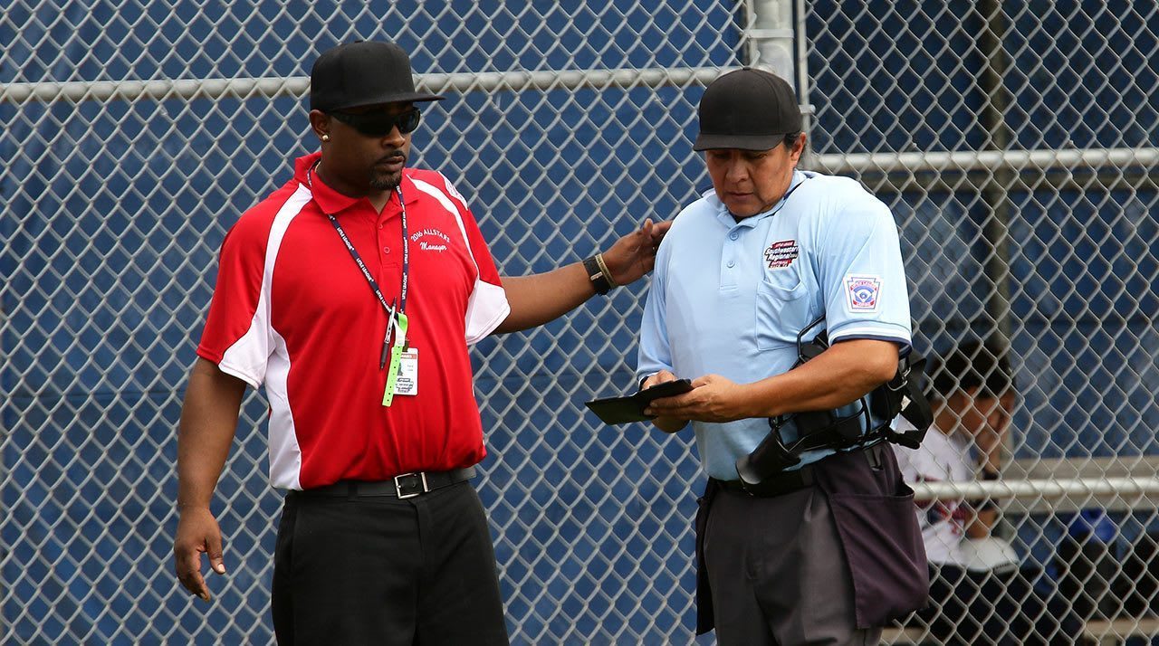 manager and umpire talking
