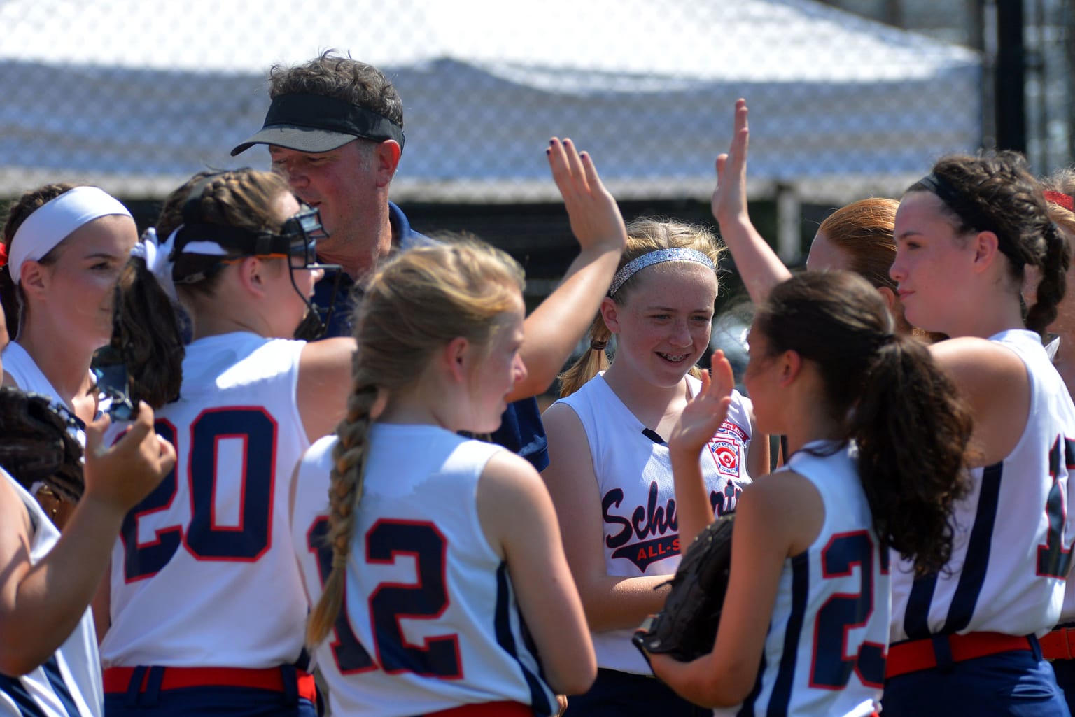 sb-coach-with-players-high-fiving