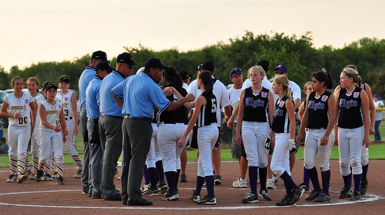 softball teams with umpires