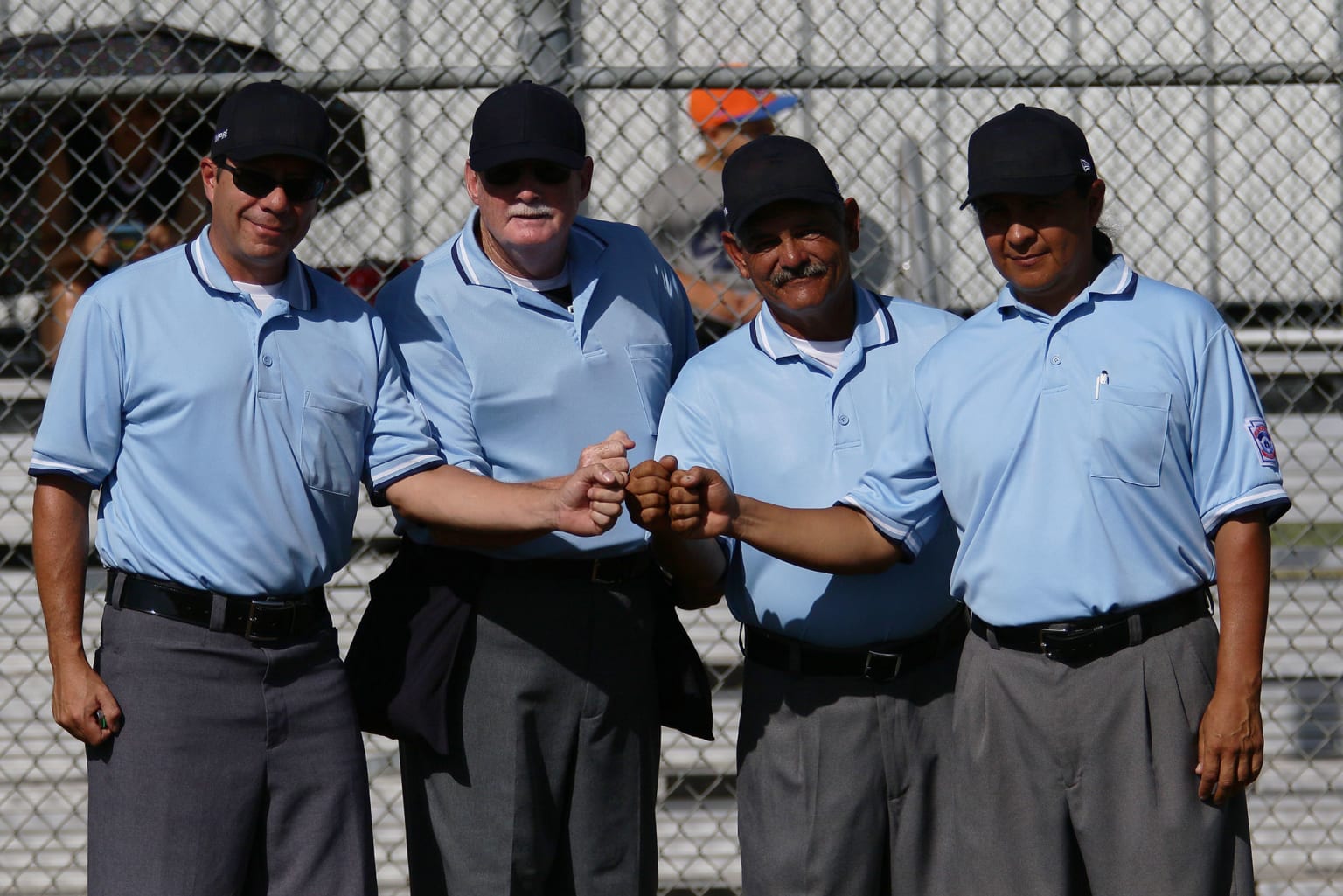 umpire fist bumping