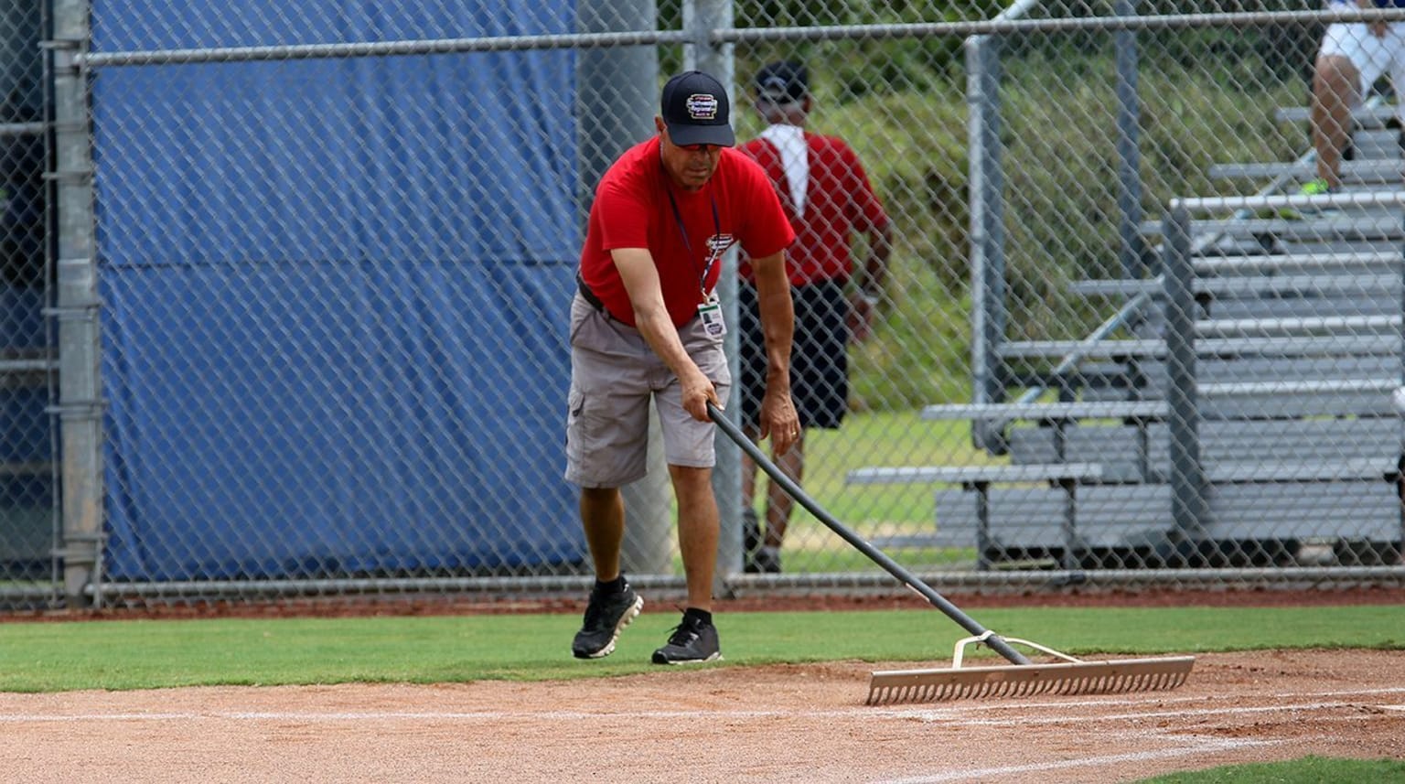 Grounds person raking