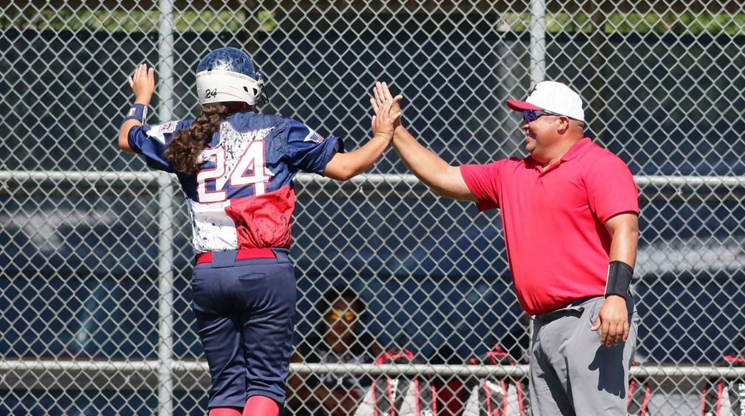 Coach and player high-fiving