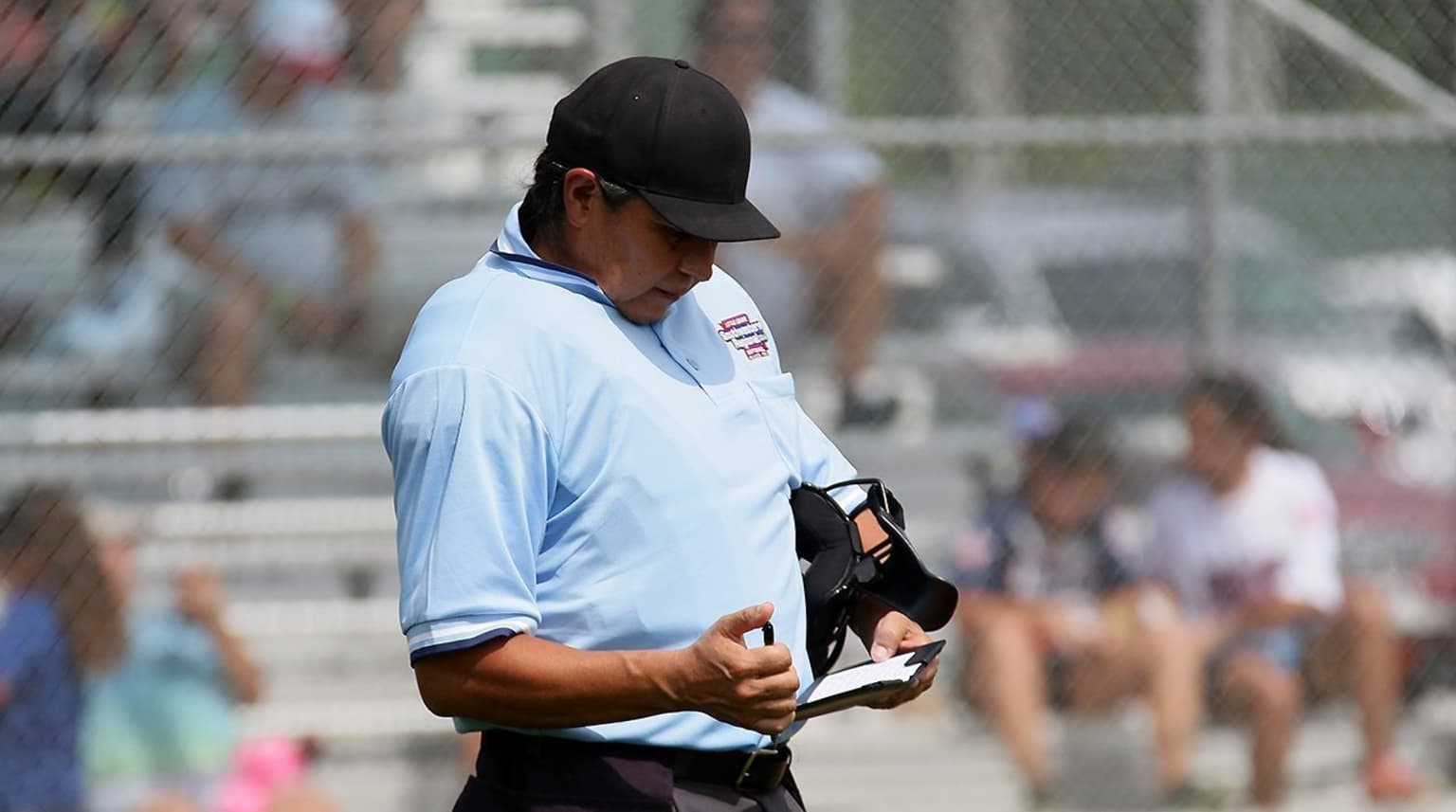 umpire looking at notes
