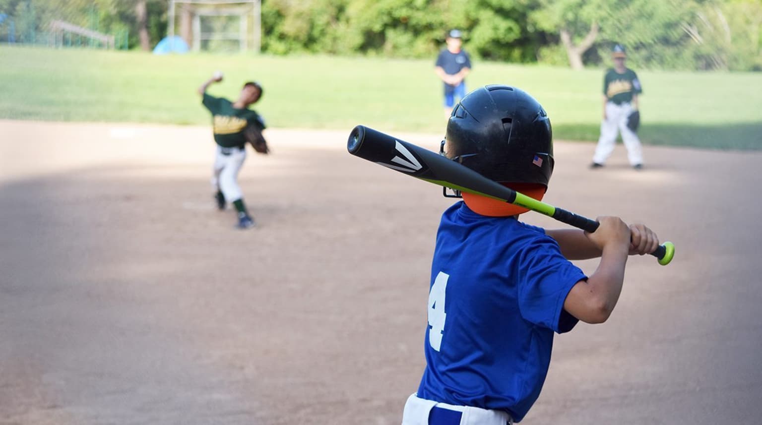 Baseball Softball Action Little league batter hits ball Stock Photo - Alamy