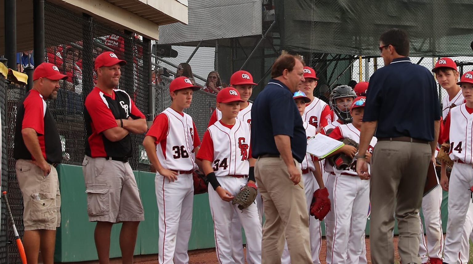 coaches and players on field