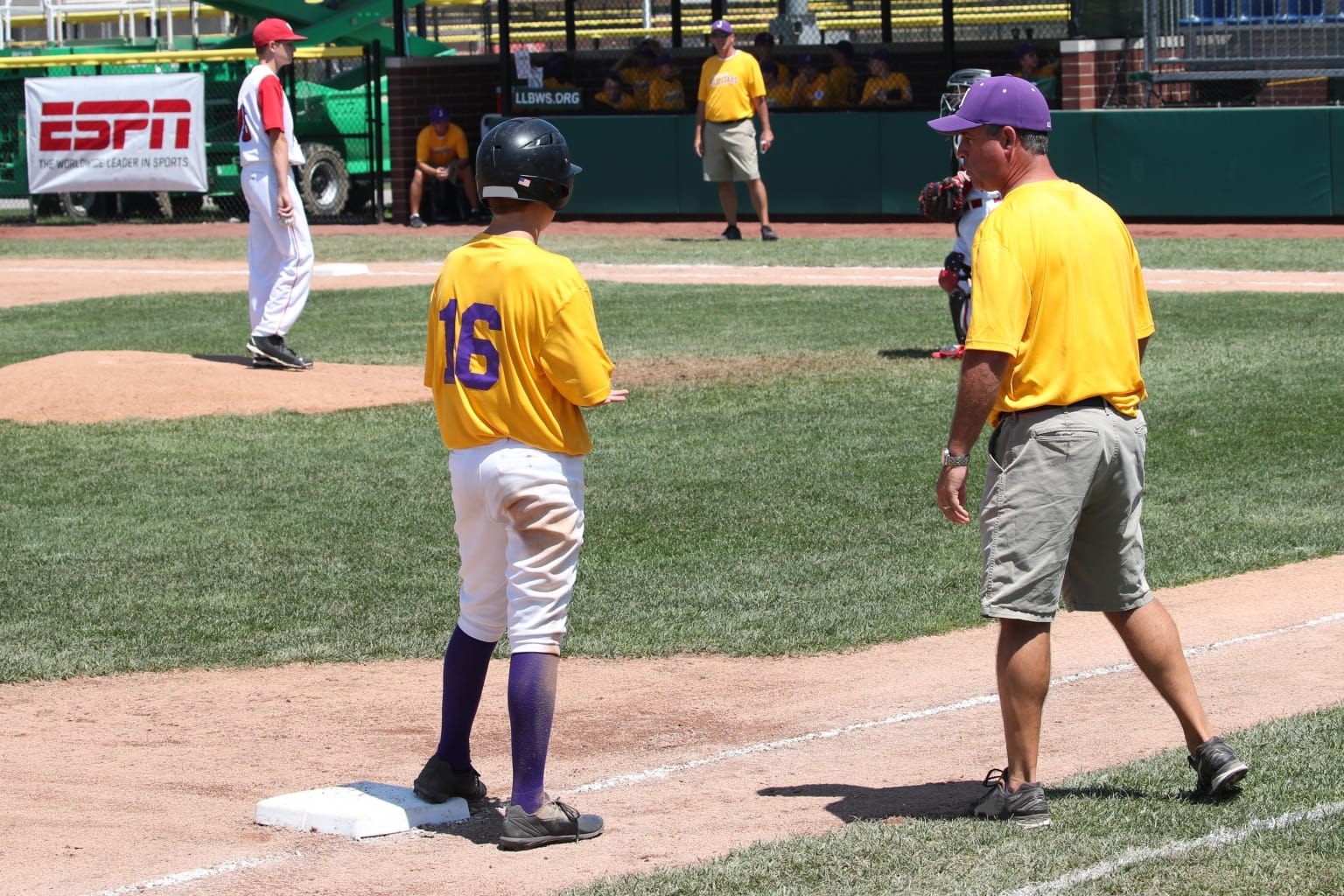 Can a baseball coach touch a runner?