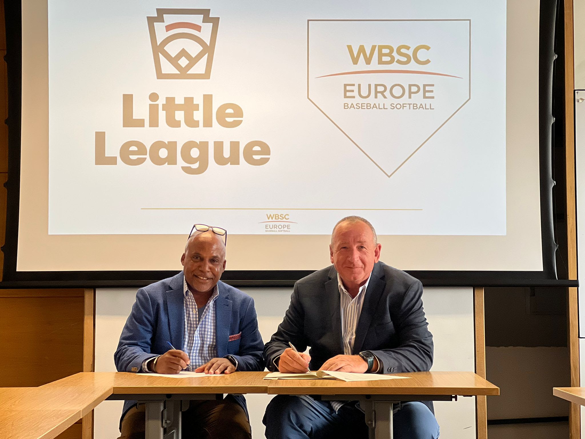 Patrick W. Wilson, Little League Chief Operating Officer, and Kruno Karin, WBSC-Europe President, signing five-year agreement in London.