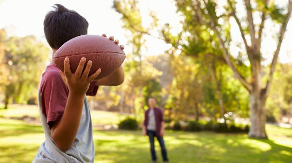 Tossing Football