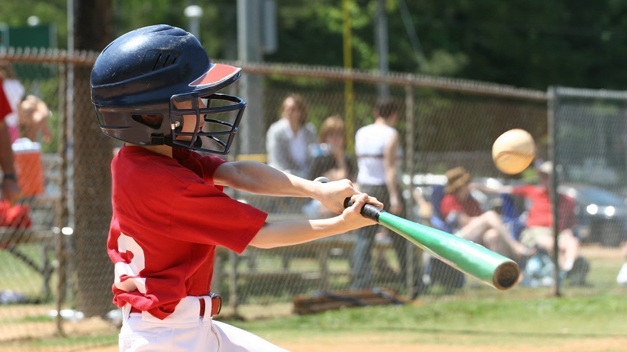 batter swinging ball
