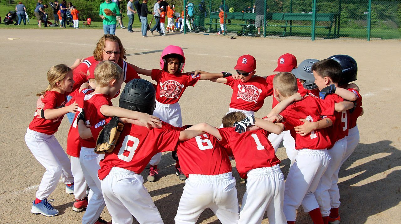players and coach in circle