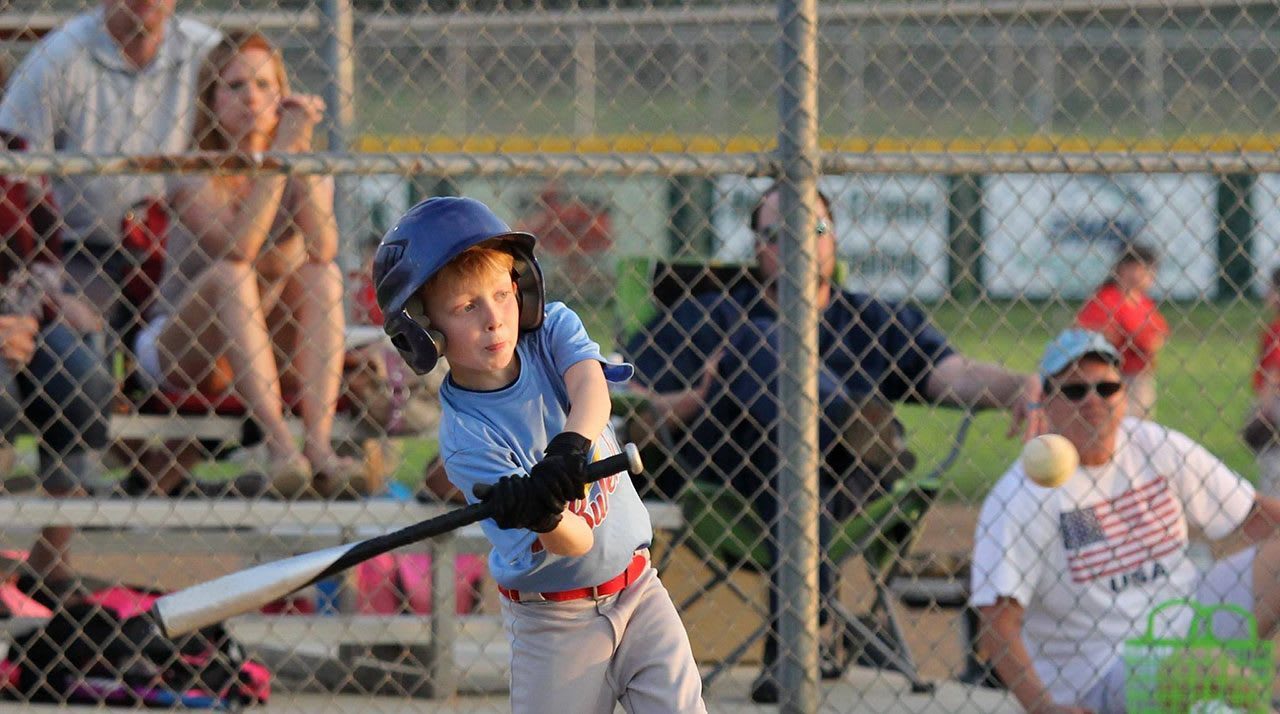 baseball player hitting ball