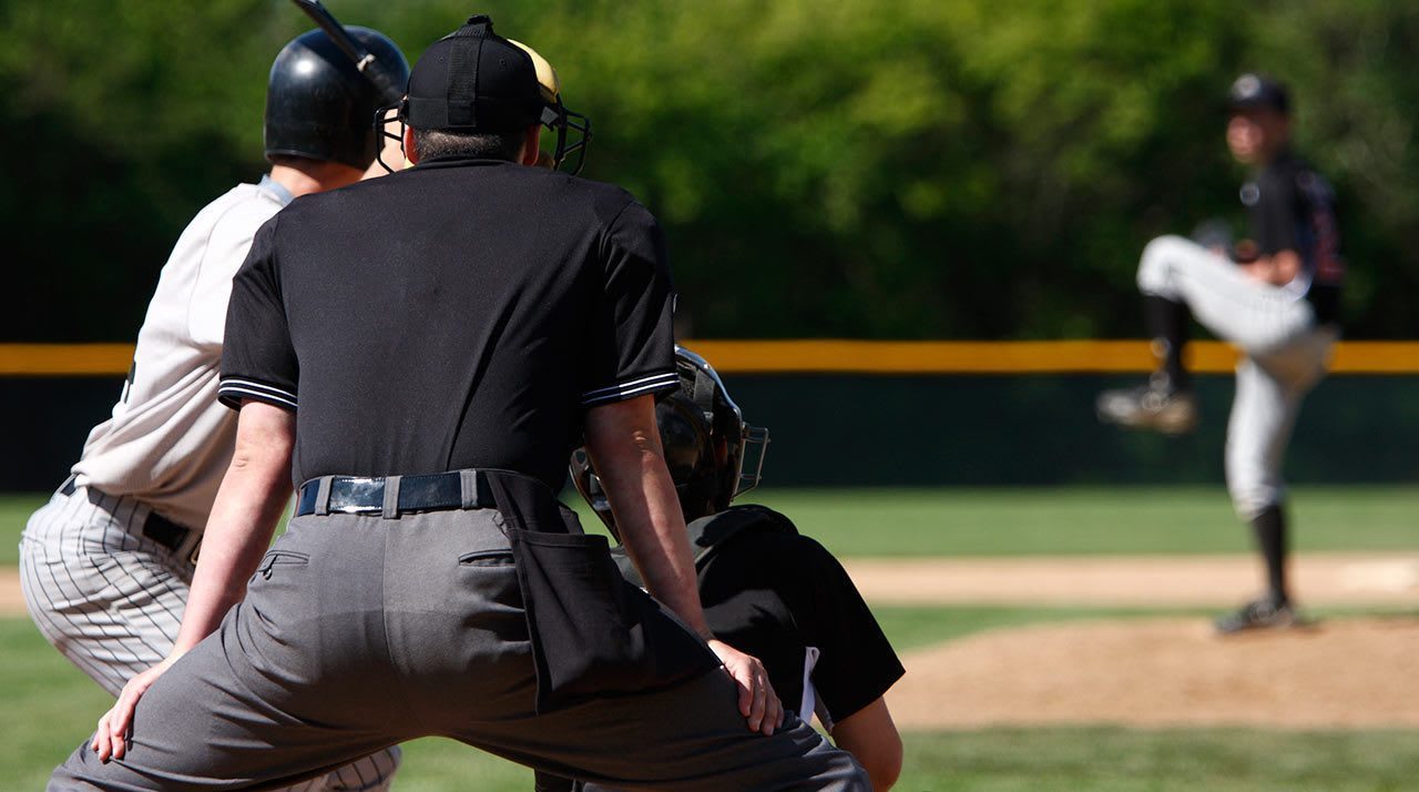 umpire and pitcher