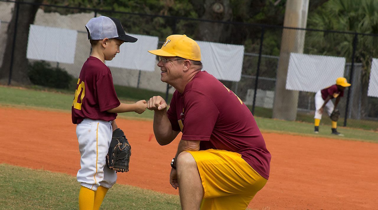 coach talking to player