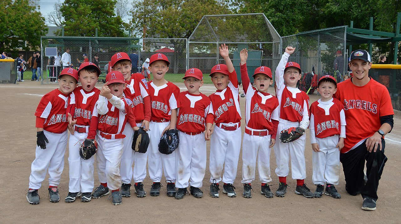 coach and tee ball players