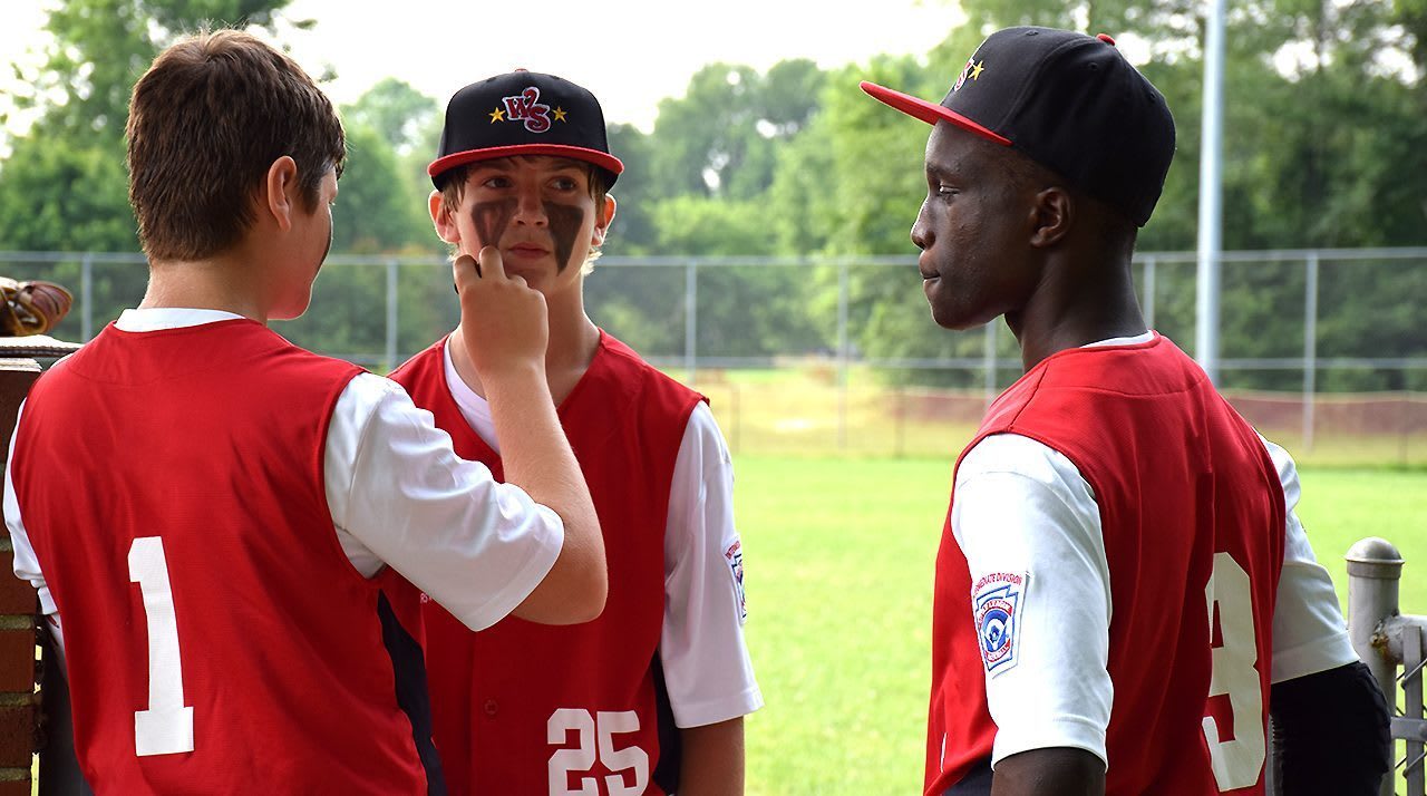 players applying eye black
