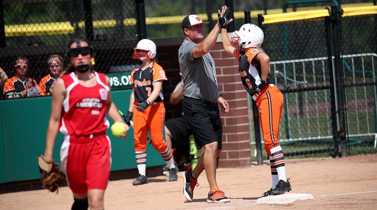 coach and player high fiving