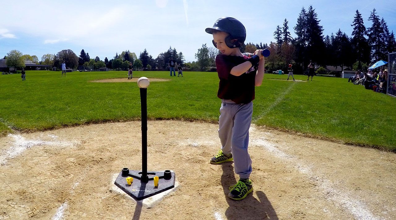 tee ball player swinging