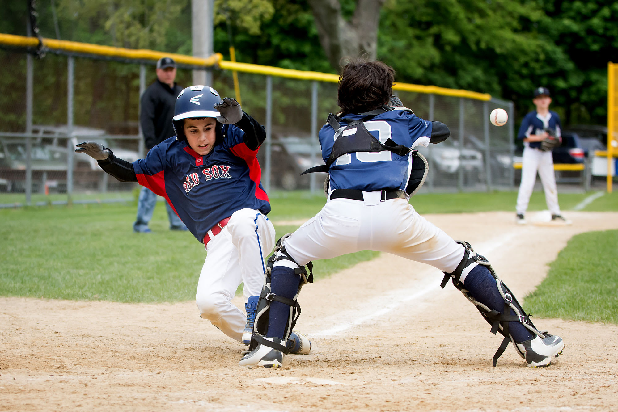 bb player sliding into home