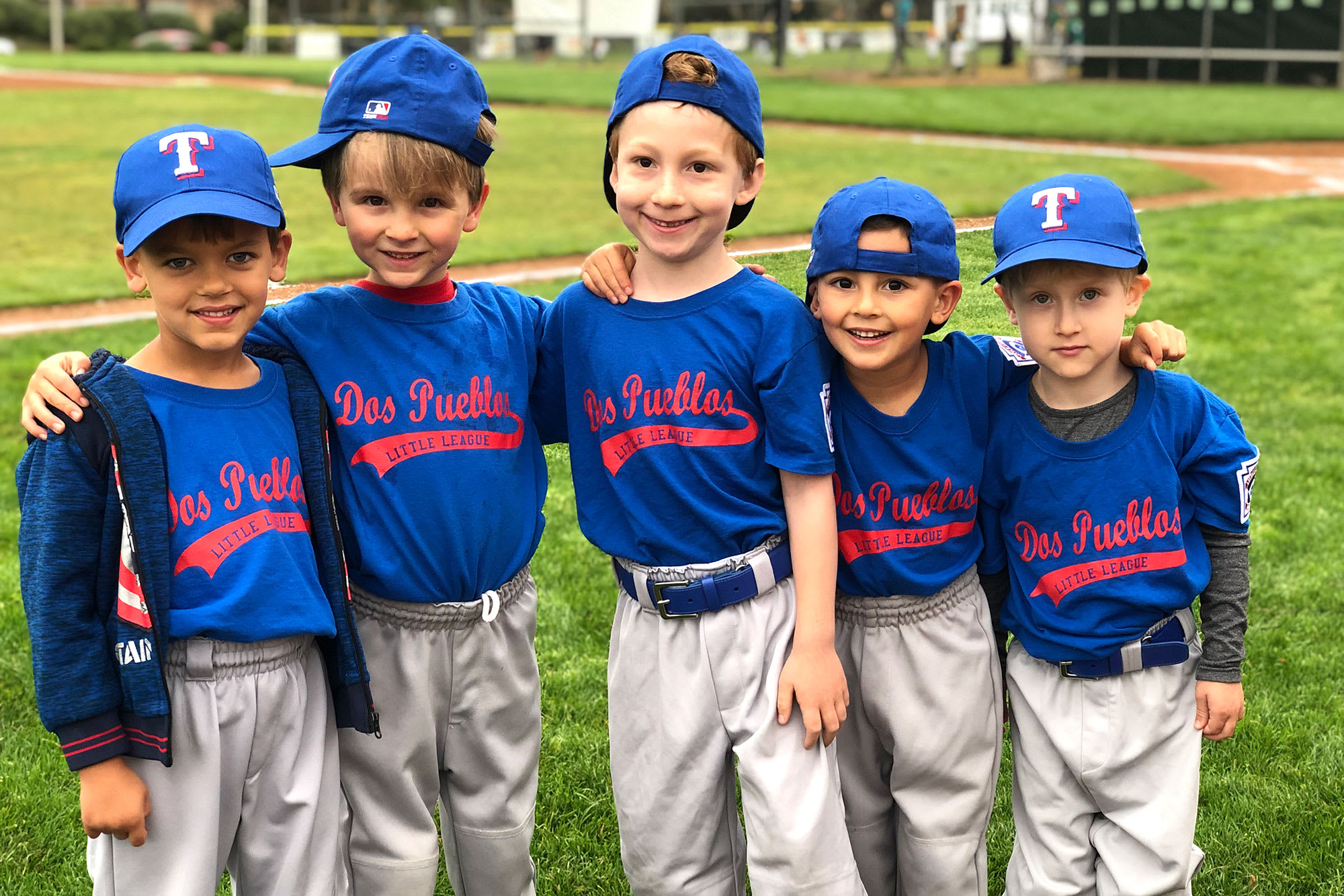 bb players standing in line smiling