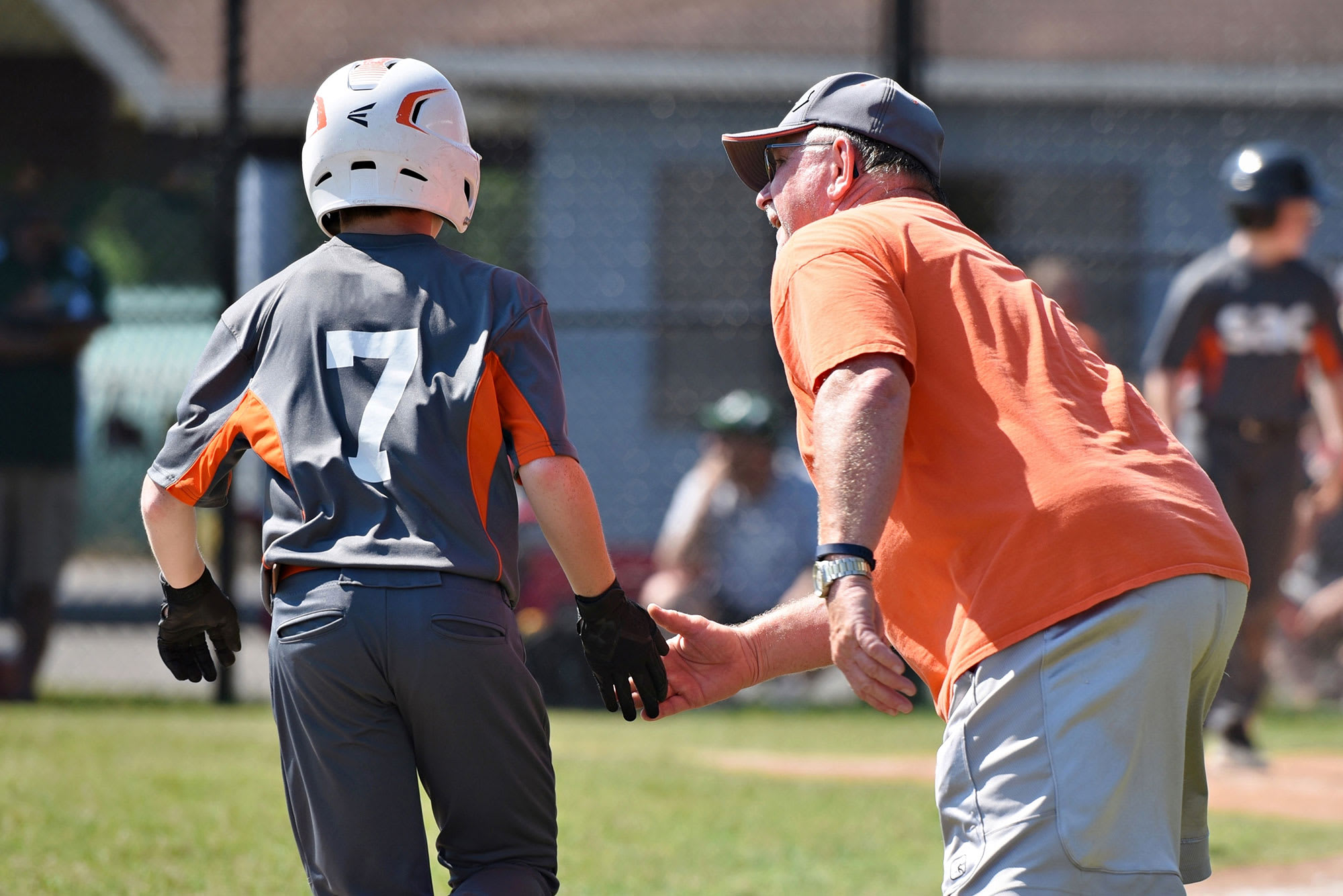 coach high fiving player