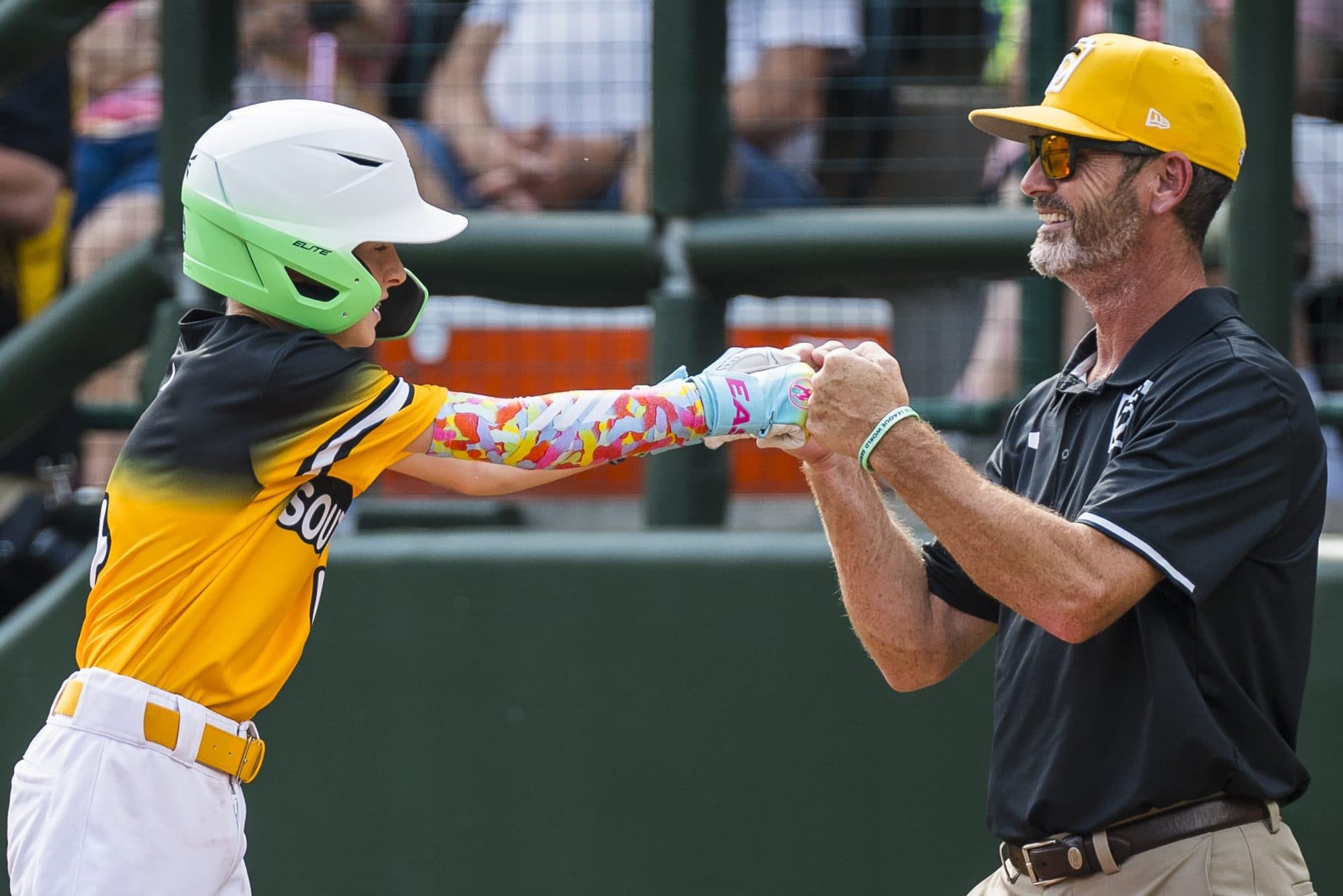 sw-coach-player-fist-bump-scrubbed