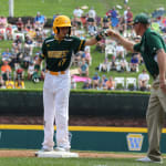MW fist bumping coach