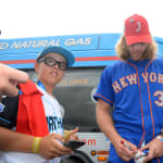 mets player signing autographs for ll players