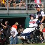 challenger game - player with wheelchair heading to home plate